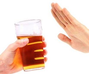 A picture of someone saying no to alcohol